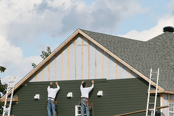 Professional Siding technician working in Johnstown, NY